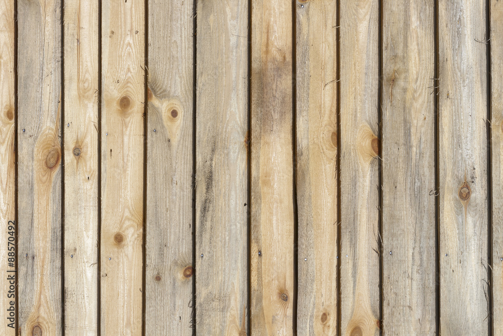 Planed wooden boards surface texture with branches background Planed wooden boards surface texture with branches background