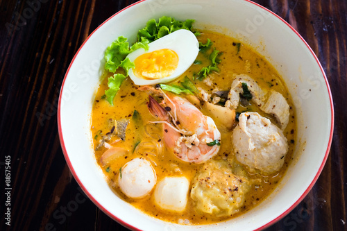 Asian noodle with seafood and egg in the tomyum soup
