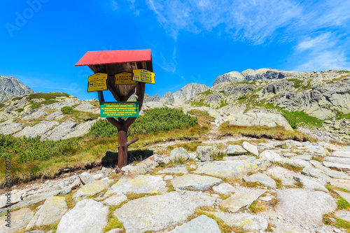 Sign with walk time distances on hiking trail in Starolesna valley, High Tatra Mountains National Park, Slovakia