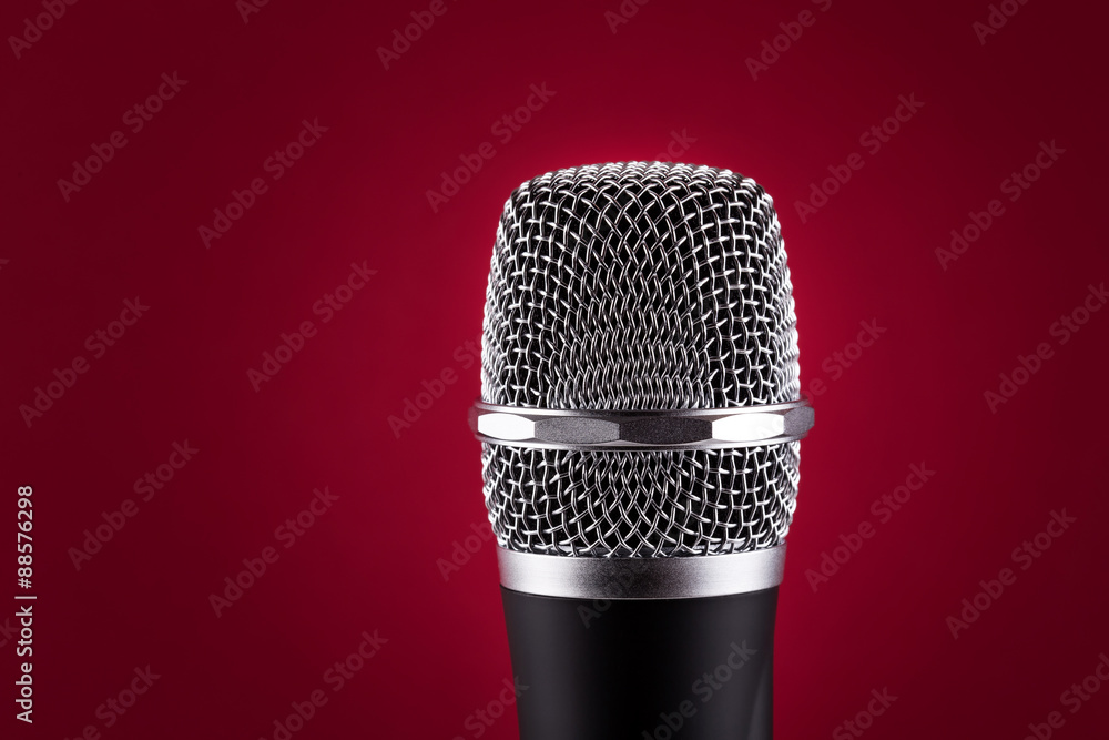 Wireless microphone on red background Wireless microphone on red background