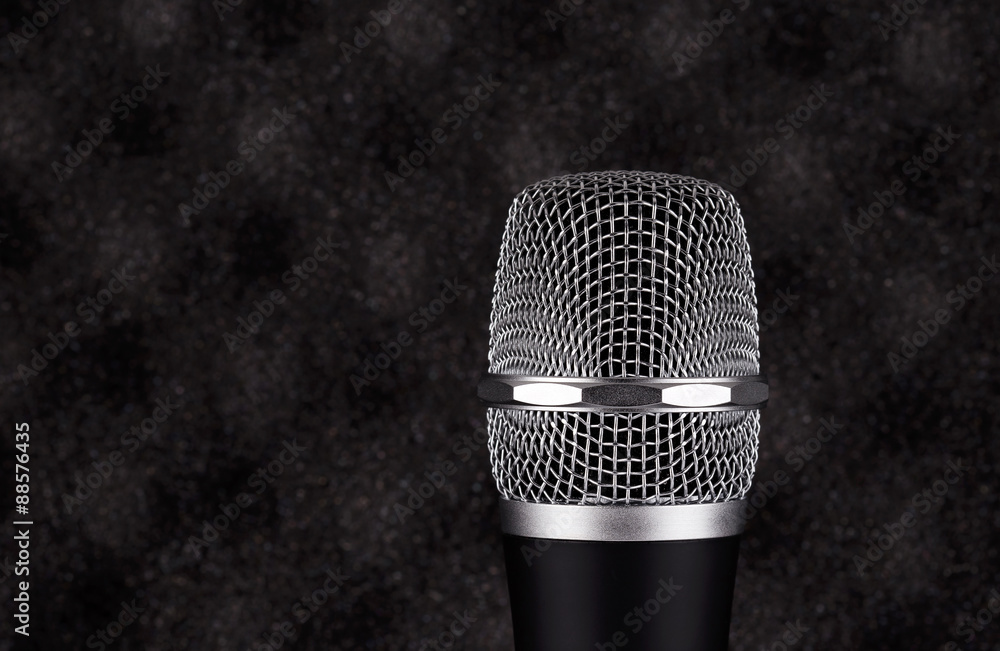 Wireless microphone closeup on foam acoustic background Wireless microphone closeup on foam acoustic background