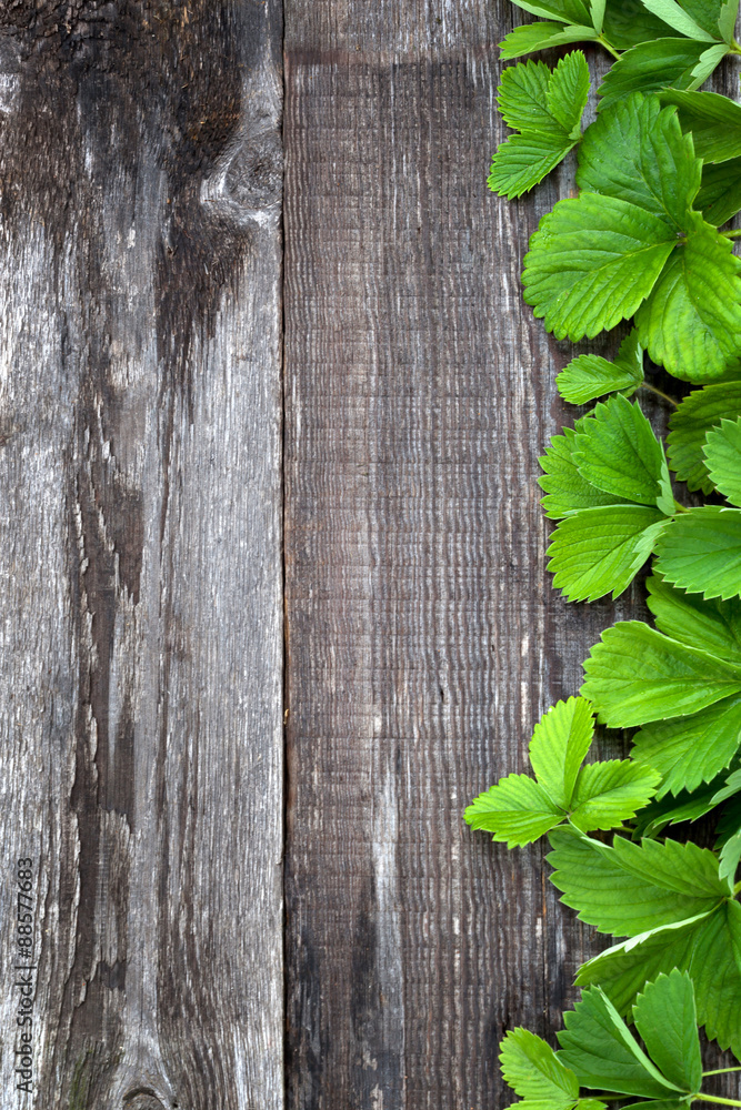 Background with ripe strawberry on wooden surface. Background with ripe strawberry on wooden surface.