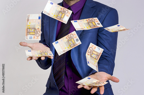 Businessman trowing money