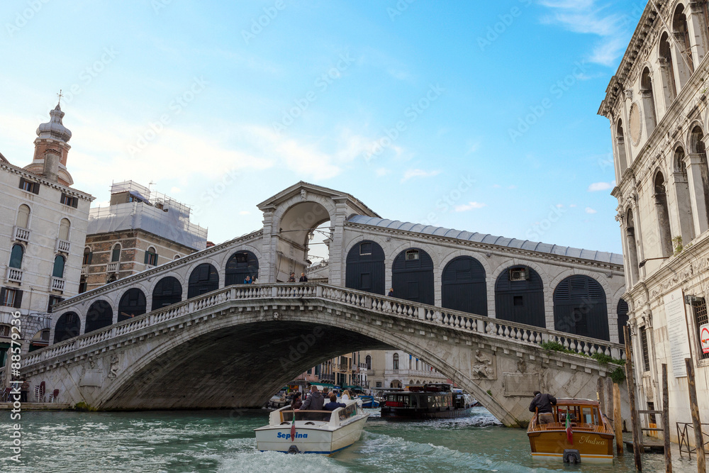 VENICE, ITALY - NOVEMBER 04, 2013: Beautiful view of Rialto's Bridge and the Canal Grande in Venice. Venice is one of the most popular tourist destinations in the world