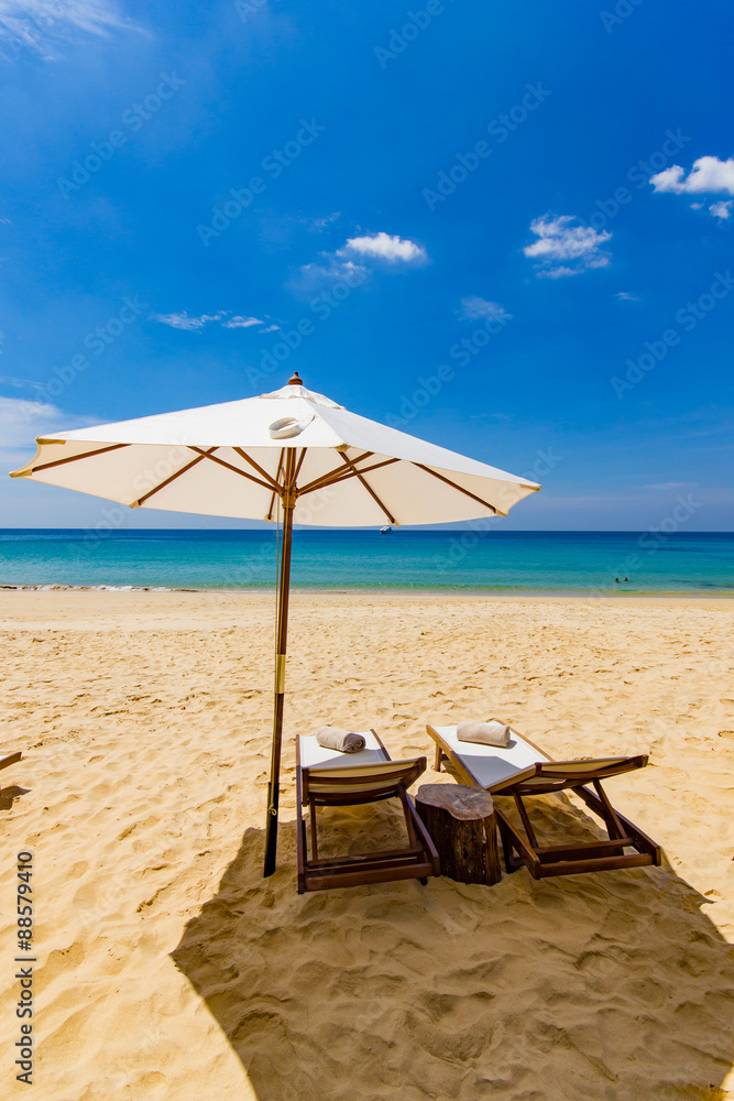 Sunbeds and umbrella at the beach