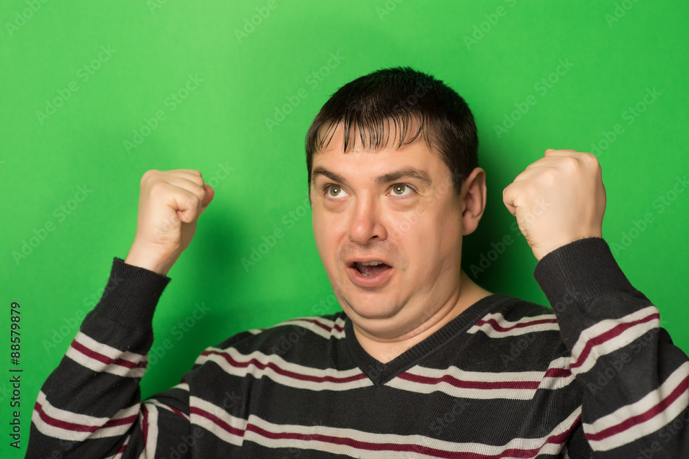 man raised his fists up