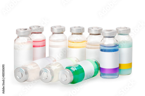 Group of the isolated vials with colored substances with clean labels