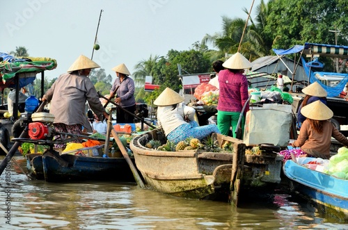 CAN THO, VIET NAM - MARCH 5 ,2015: Unidentified Vietnamese women on the Floating Market in Can Tho, Vietnam.