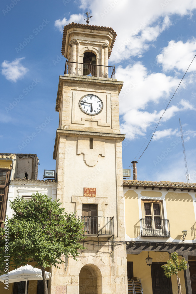 Fototapeta premium bell tower with a clock in La Mancha square - Chinchilla de Monte Aragon - Albacete - Spain