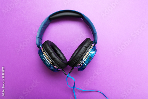 Headphones on purple background