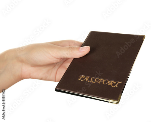 Female hand holding passport isolated on white