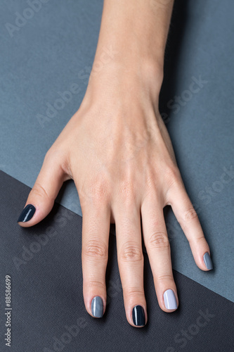 Female hand with a stylish neutral manicure