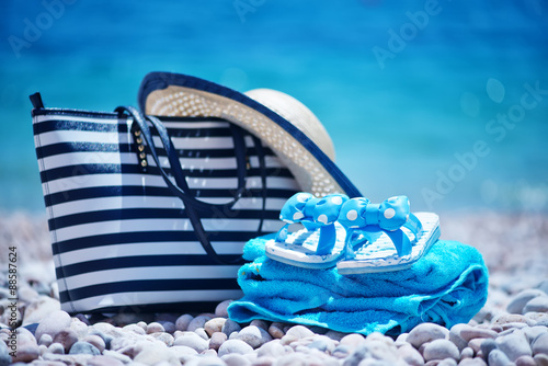 bag and hat on the beach