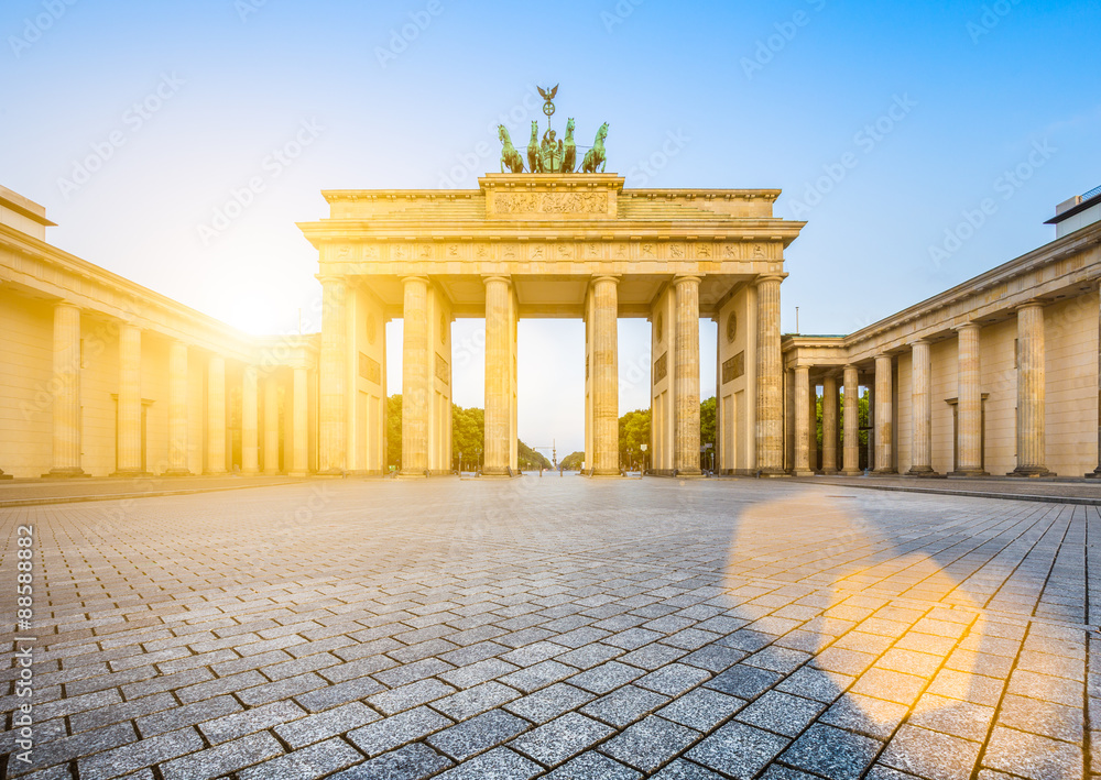 Brandenburger Tor (Brandenburg Gate) in golden morning light at sunrise, Berlin, Germany