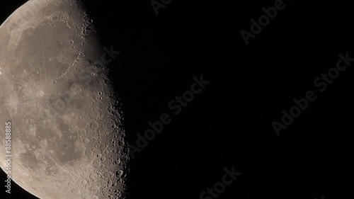 Moon in waning gibbous showing crater details and atmospheric jitter called 