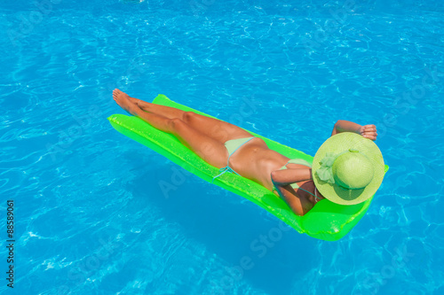 Young woman wearing a straw hat