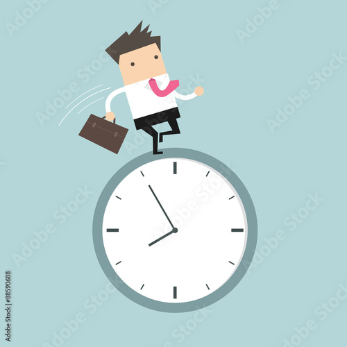 Businessman running on clock