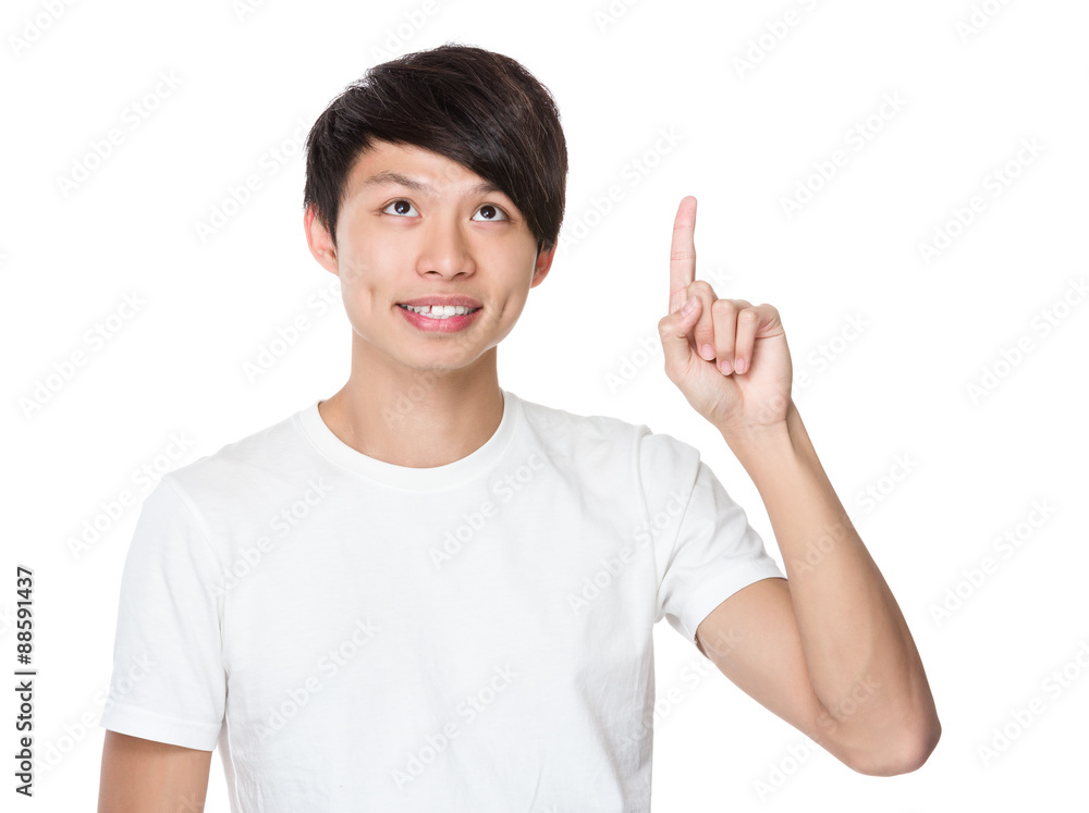 Asian young man with finger point up Asian young man with finger point up