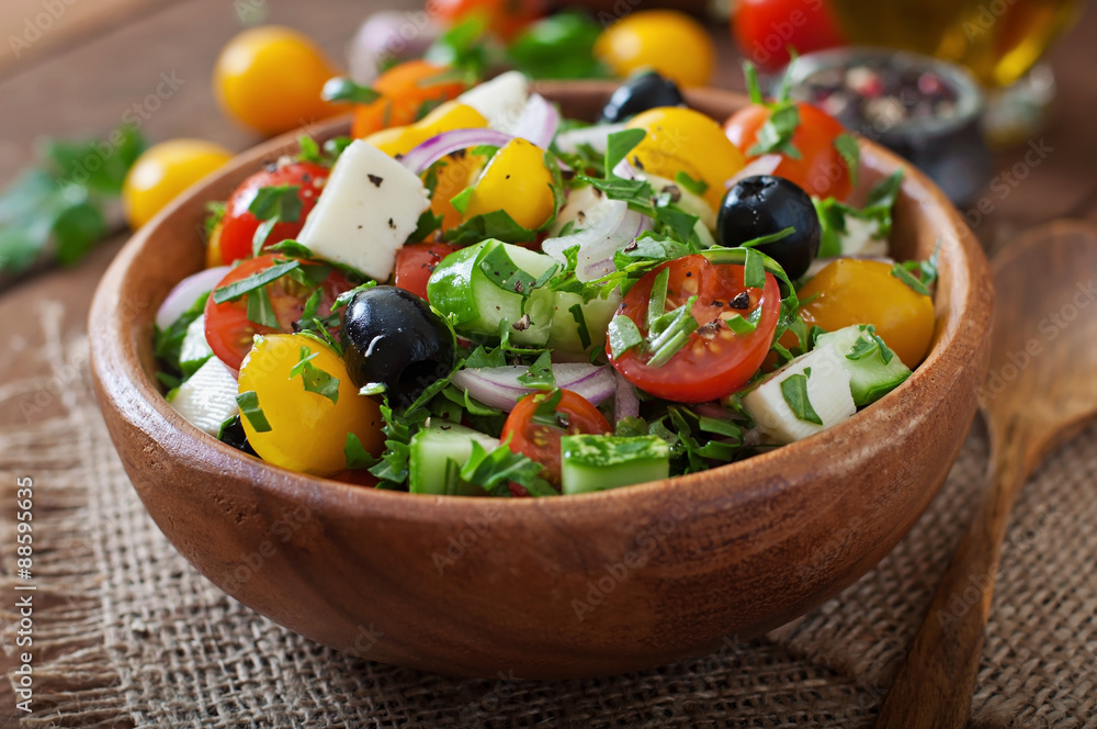 Greek salad with fresh vegetables, feta cheese and black olives Greek salad with fresh vegetables, feta cheese and black olives