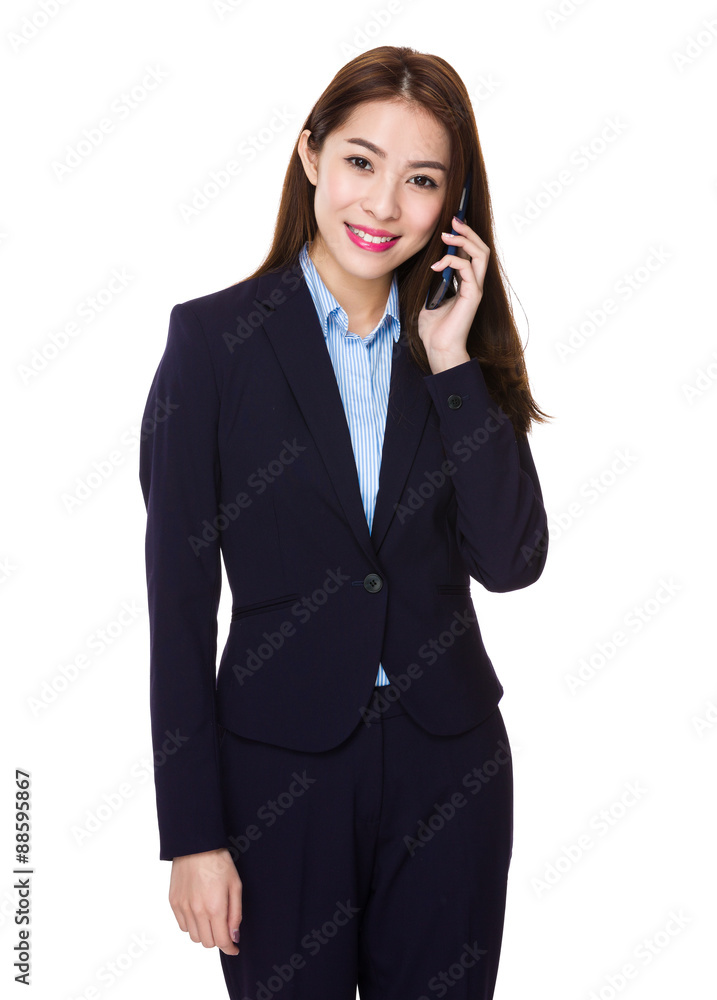 Asian businesswoman talk to cellphone Asian businesswoman talk to cellphone