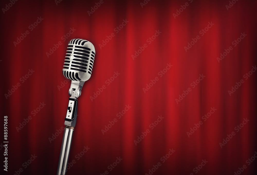 Fototapeta premium Audio retro microphone with red curtain
