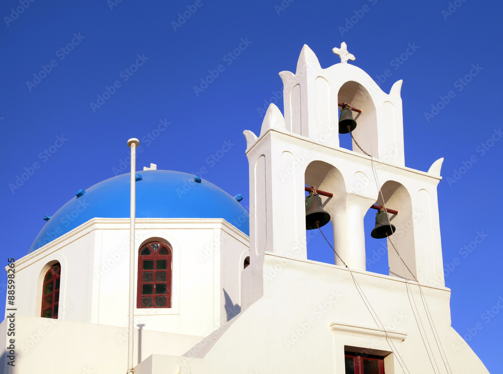 Blue dome greek orthodox church and belltower, Santorini, Greece