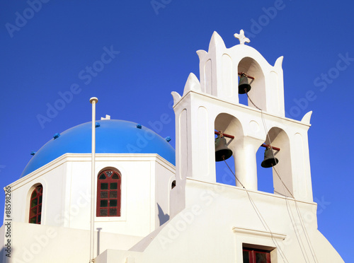 Blue dome greek orthodox church and belltower, Santorini, Greece