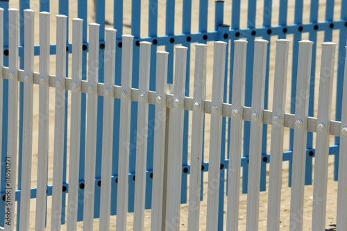 colorful fence of a playground on the beach in summer