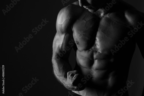 Man Flexing Biceps Sport Background