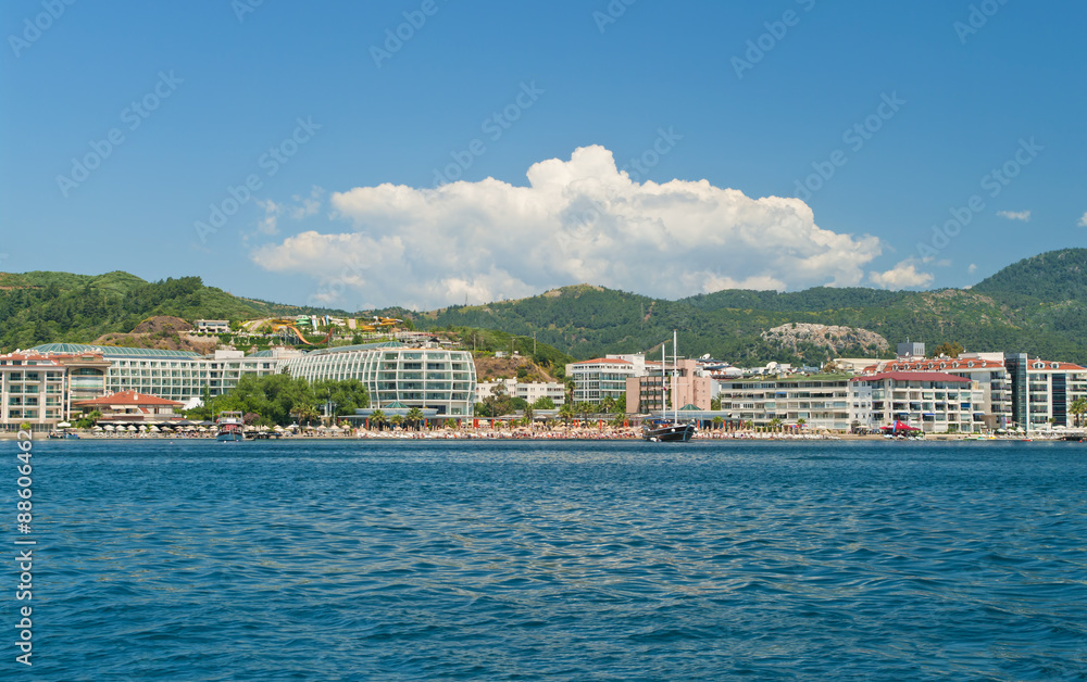 view of beach with hotels and sunbeds from sea
