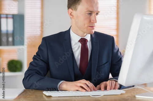 Focused businessman working at his desk