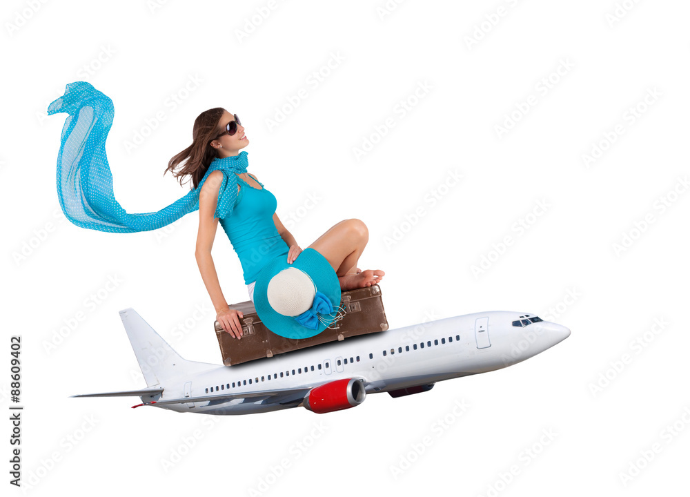 Fototapeta premium Young woman sitting on airplane