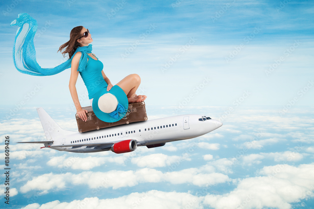 Fototapeta premium Young woman sitting on airplane