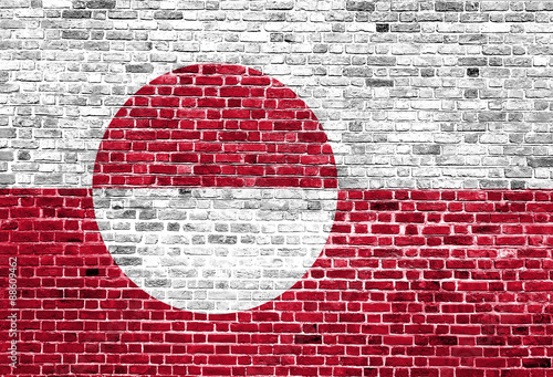 Flag of Greenland painted on brick wall, background texture
