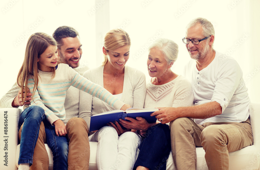 happy family with book or photo album at home happy family with book or photo album at home