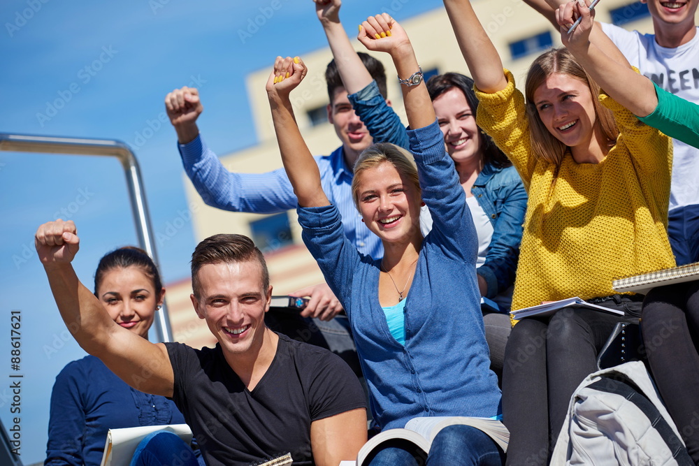 Fototapeta premium students outside sitting on steps