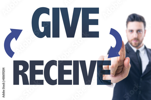 Business man pointing the text: Give/Receive photo