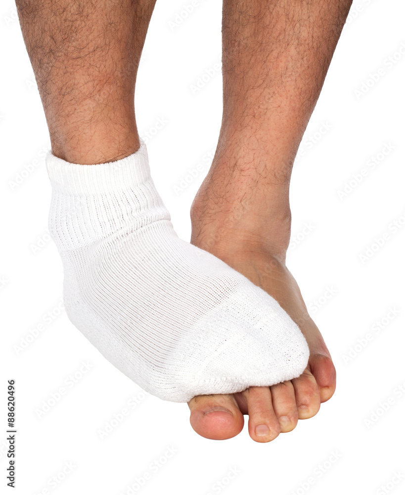 Man's foot with sock covers the other foot Man's foot with sock covers the other foot