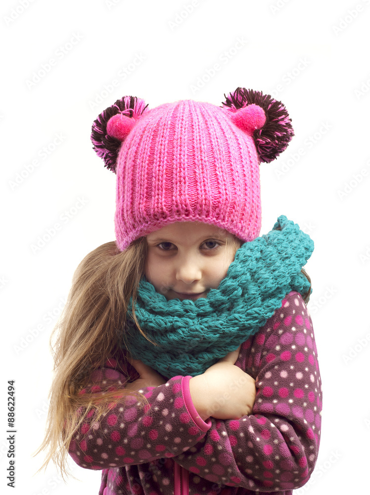 Portrait of a girl in a cap and scarf . Portrait of a girl in a cap and scarf .