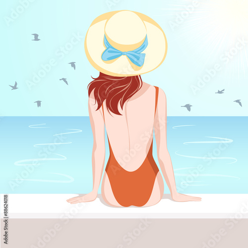 Girl in swimsuit looking at the sea