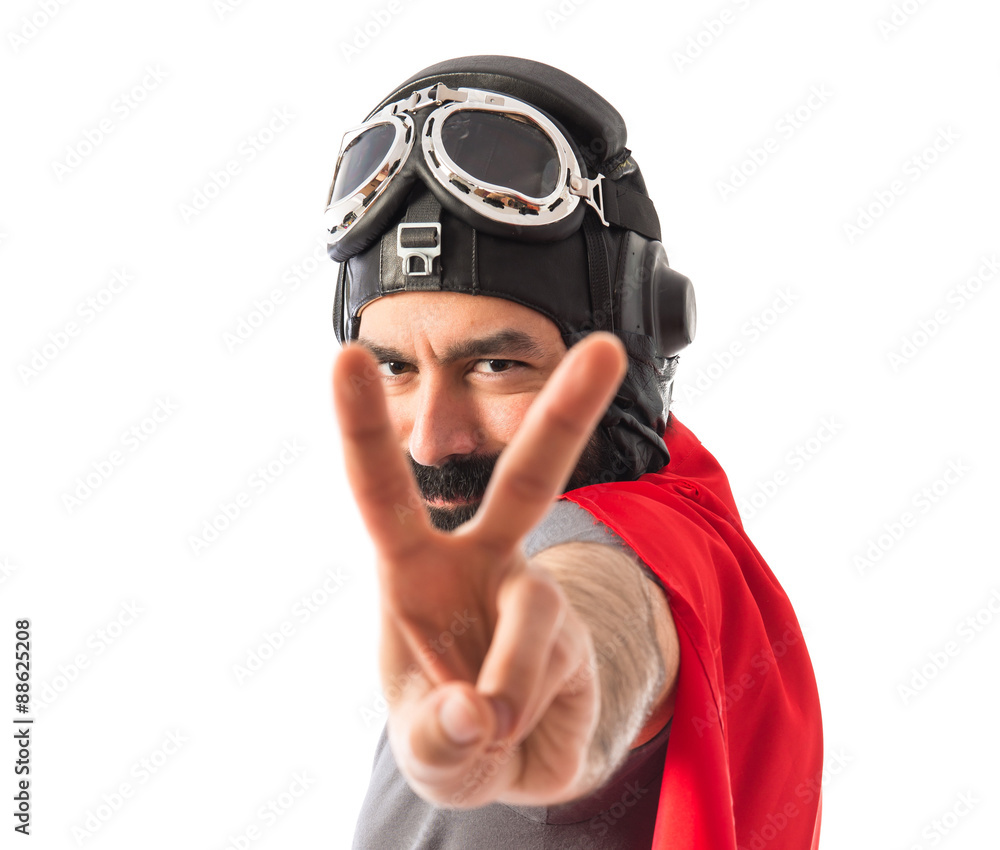 Superhero doing victory gesture