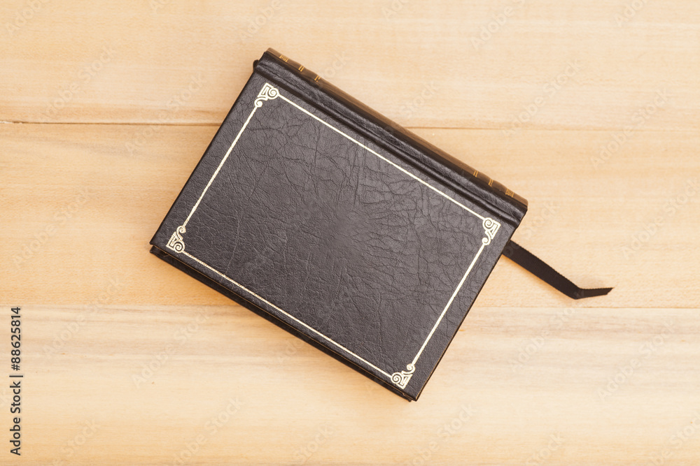 Book cover on wooden background Book cover on wooden background