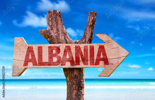 Albania wooden sign with beach background