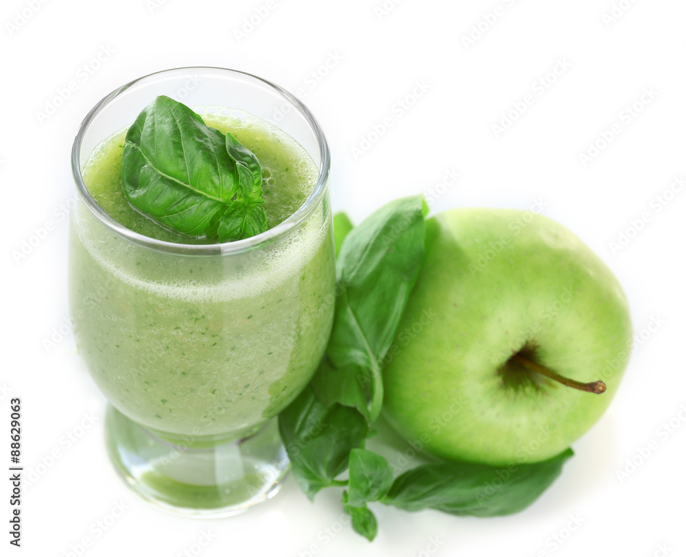 Glass of green healthy juice with basil and apple isolated on white Glass of green healthy juice with basil and apple isolated on white