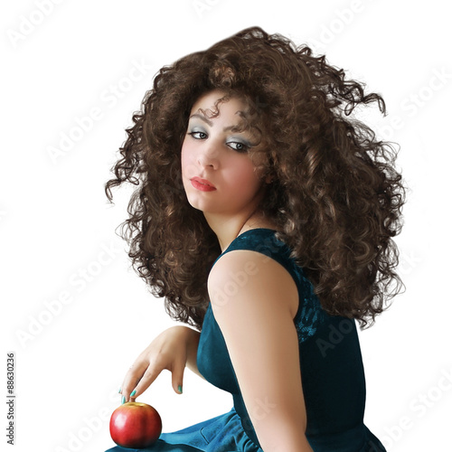 Φωτογραφία The girl with long hair and an apple on white background