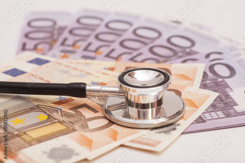 Euro banknotes and stethoscope