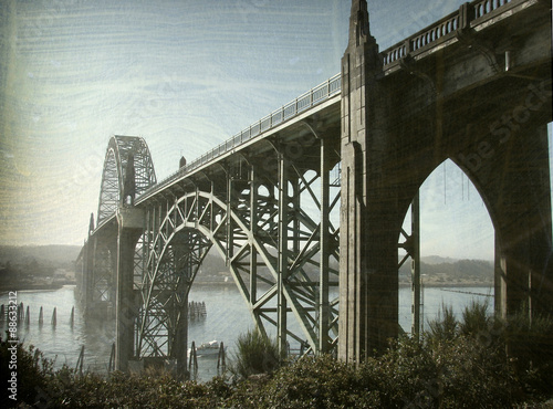 aged and worn vintage photo of bridge in taquina bay photo