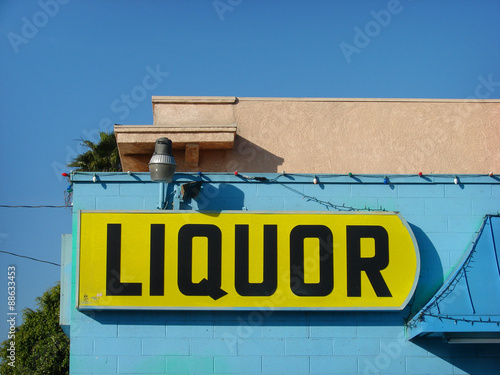Vászonkép liquor store sign on blue building