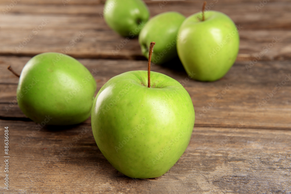Ripe green apples on wooden table close up Ripe green apples on wooden table close up