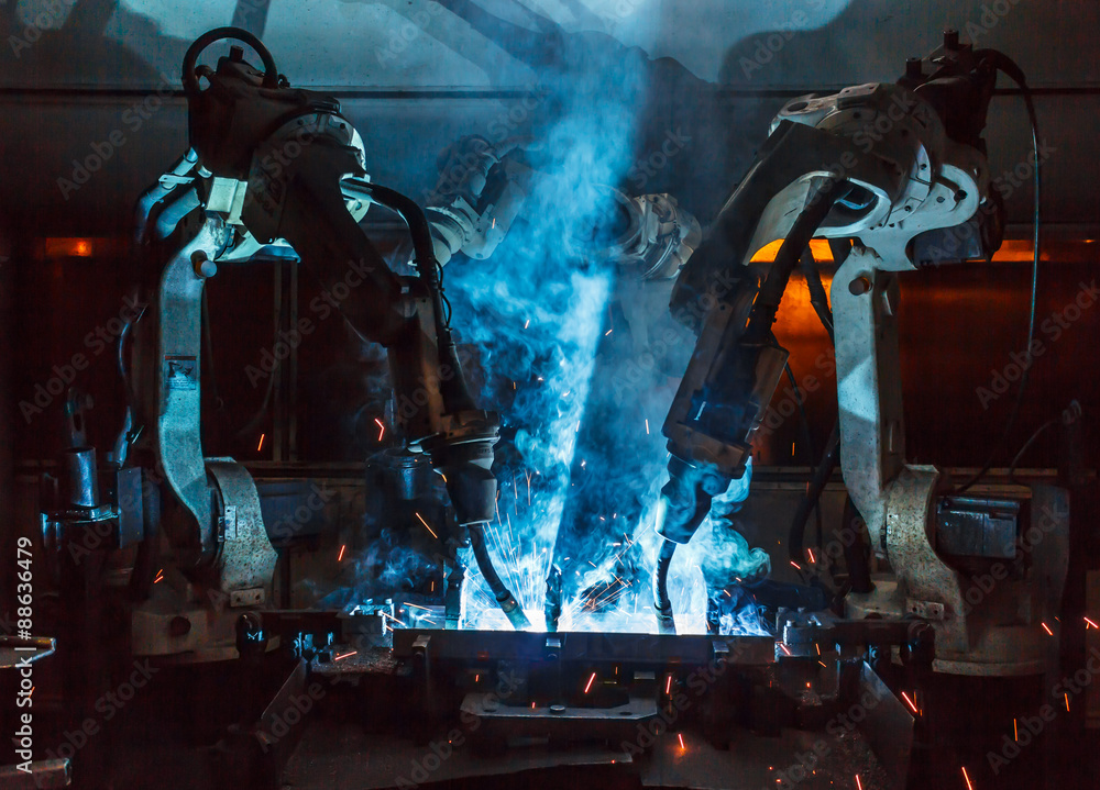 robots welding in a car factory robots welding in a car factory